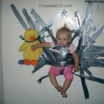 child taped to wall